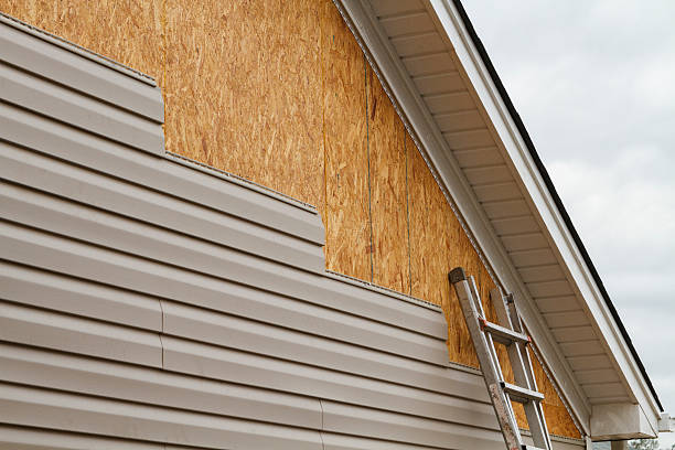 Professional Storm Damage Siding Repair technician working in Jericho, NY